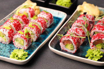 Assorted sushi nigiri and maki big set on slate. A variety of Japanese sushi with tuna, crab, salmon, eel and rolls. Top view