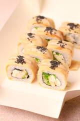 Assorted sushi nigiri and maki big set on slate. A variety of Japanese sushi with tuna, crab, salmon, eel and rolls. Top view