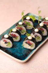 Assorted sushi nigiri and maki big set on slate. A variety of Japanese sushi with tuna, crab, salmon, eel and rolls. Top view