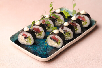 Assorted sushi nigiri and maki big set on slate. A variety of Japanese sushi with tuna, crab, salmon, eel and rolls. Top view