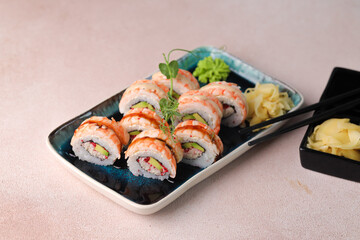 Assorted sushi nigiri and maki big set on slate. A variety of Japanese sushi with tuna, crab, salmon, eel and rolls. Top view