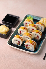 Assorted sushi nigiri and maki big set on slate. A variety of Japanese sushi with tuna, crab, salmon, eel and rolls. Top view