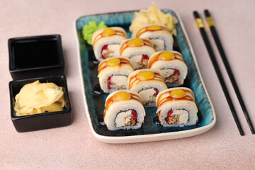 Assorted sushi nigiri and maki big set on slate. A variety of Japanese sushi with tuna, crab, salmon, eel and rolls. Top view