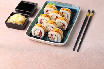 Assorted sushi nigiri and maki big set on slate. A variety of Japanese sushi with tuna, crab, salmon, eel and rolls. Top view