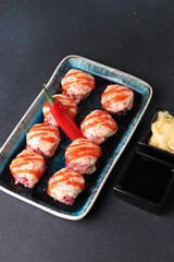 Assorted sushi nigiri and maki big set on slate. A variety of Japanese sushi with tuna, crab, salmon, eel and rolls. Top view