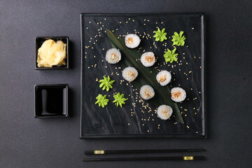 Assorted sushi nigiri and maki big set on slate. A variety of Japanese sushi with tuna, crab,...