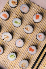 Assorted sushi nigiri and maki big set on slate. A variety of Japanese sushi with tuna, crab, salmon, eel and rolls. Top view