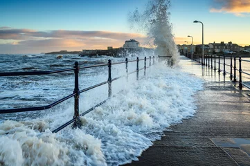 Papier Peint photo Europe du nord Wave engulfs Amble Pier.  Amble Harbour is actually called Warkworth Harbour and is set on the banks of the River Coquet in Northumberland in the North East of England
