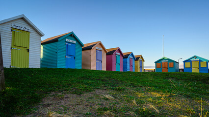 Amble Beach Huts at Warkworth Harbour.  Amble Harbour is actually called Warkworth Harbour and is set on the banks of the River Coquet in Northumberland in the North East of England - obrazy, fototapety, plakaty