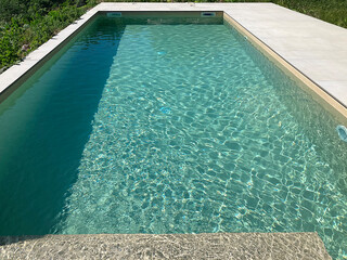 Obraz premium Swimming pool in a luxury villa in the city park