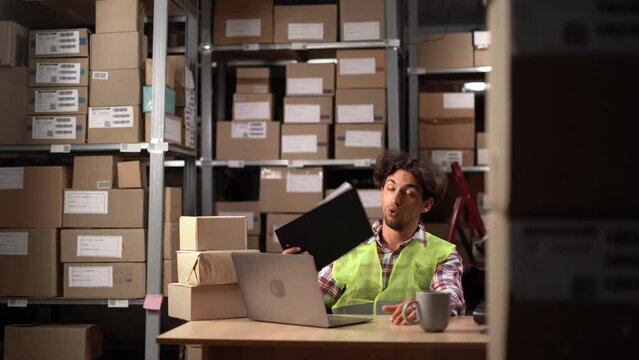 exhausted male worker annoyed guy suffer from summer heat in warehouse office without air conditioner feeling hot temperature. uncomfortable