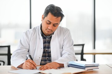 Portrait of a young doctor student studying