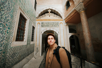 Interior of Sultanahmet in istanbul Turkey. Close-up hispanic tourist posing.