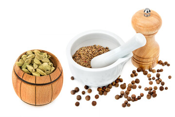 Set of spices, mortar with pestle and grinder isolated on white. Collage. Free space for text.