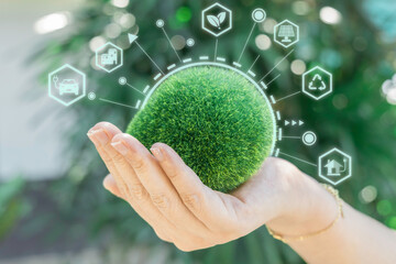 Hand holding green earth ESG icon for environment social network and governance in sustainable and ethical business on the Network connection. World environment concept.