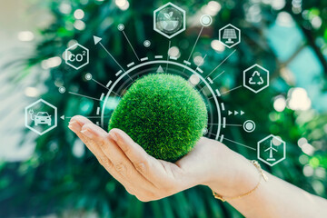 Hand holding green earth ESG icon for environment social network and governance in sustainable and ethical business on the Network connection. World environment concept.