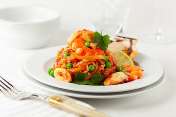 Rice with seafood. food served on elegant plate. Peruvian food, selective focus.