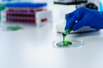 Laboratory concept: Close-up of chemicals in a laboratory, a biochemist is conducting experiments...