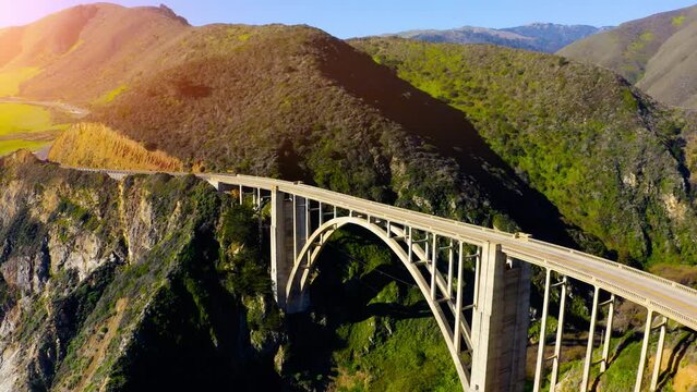 Bixby Creek Bridge and Highway 101 Amidst Mountain and Ocean. Cinematic Shot of Bixby Creek Bridge in California. 