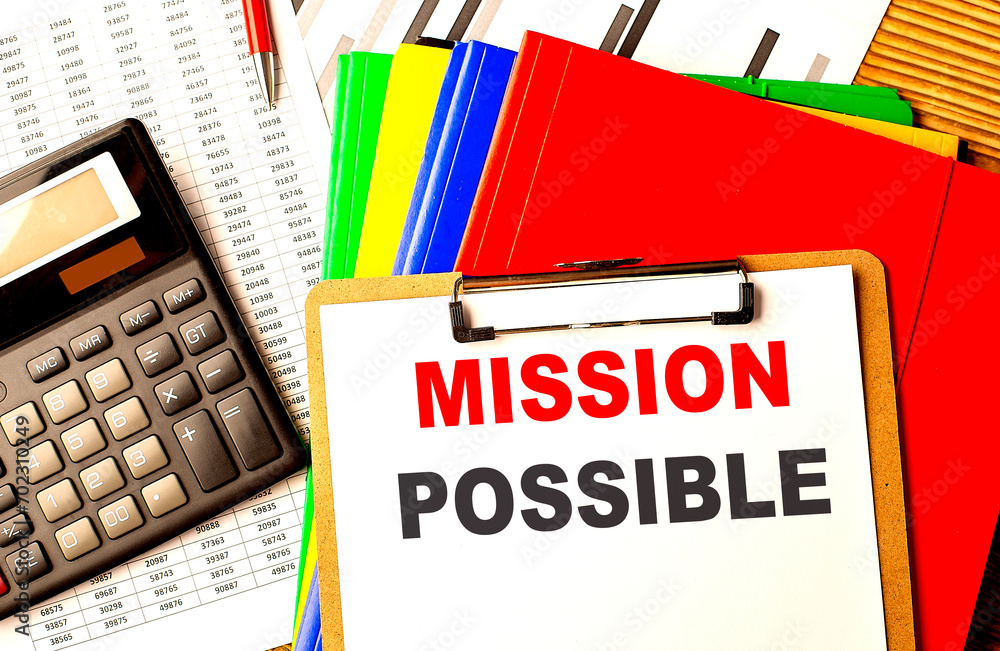 Poster mission possible text written on paper clipboard with chart and calculator