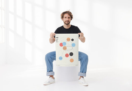 Mockup of man holding customizable A2 poster