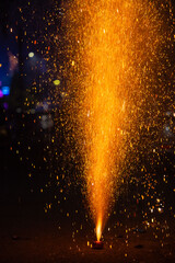 Flower Pots or Anar fireworks burning with sparkle during the festival of diwali in India.