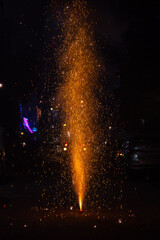 Flower Pots or Anar fireworks burning with sparkle during the festival of diwali in India.