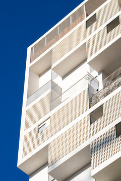 Detail of the white facade of a modern apartment building in the city of Madrid in Spain