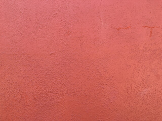 Punch red cement wall. Pink red texture background. Wallpaper. 