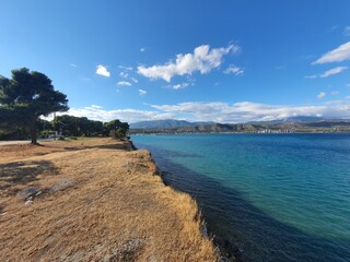 View from saronic golf to to bay at corinth canal with lots of cargo ship in Peloponnes, Greece