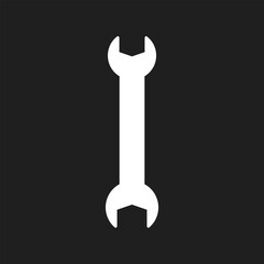 Wrench icon on black background.