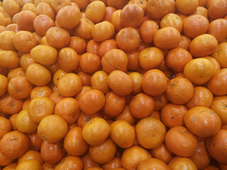 Oranges on market stall. Bunch of bright color oranges. Texture background ripe juicy fruits oranges. Product Image Tropical Oranges Fruit