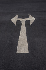 symbol on a black asphalt road