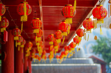 Focus on red Chinese lantern with the Chinese character Blessings written on it.