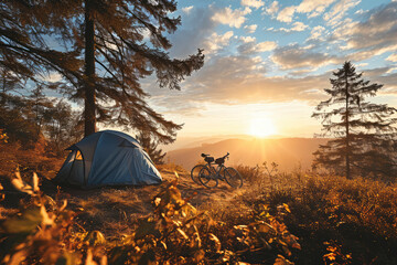 Mountain biking and tent camping in nature at sunset