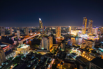 Beautiful cityscape Bangkok river boat business district and residential. In the twilight,