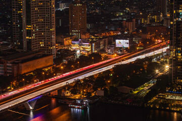 Beautiful cityscape Bangkok river boat business district and residential. In the twilight,