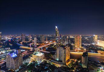 Fototapeta na wymiar Beautiful cityscape Bangkok river boat business district and residential. In the twilight,