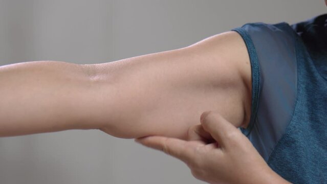 The flabbiness and wrinkled of senior woman arm skin.