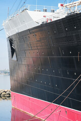 Partial view of superstructure and hull of famous tourist destination and historic ocean liner...