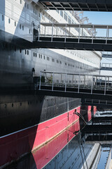 Partial view of superstructure and hull of famous tourist destination and historic ocean liner...