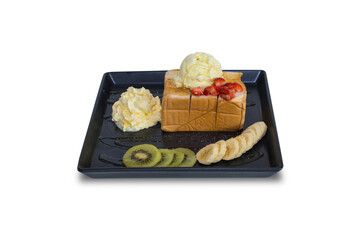 honey toast with vanilla ice-cream, on black dish