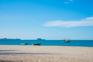 Fototapeta na wymiar fishing boat on the sea with blue sky, Hua-Hin , Thailand