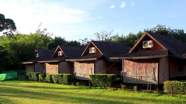 Wooden bamboo cottages huts natural tropical jungle resort Krabi Thailand.