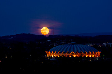 Moon behind Coliseum composite