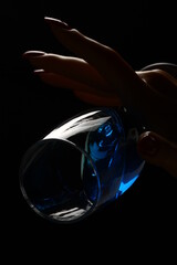 Female hand with champagne glass on black and white background