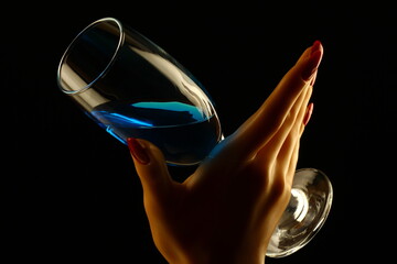 Female hand with champagne glass on black and white background
