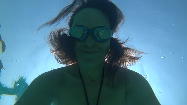 Kas, Turkey - 3d of September 2023: 4K Selfie Freediver smiles underwater 
