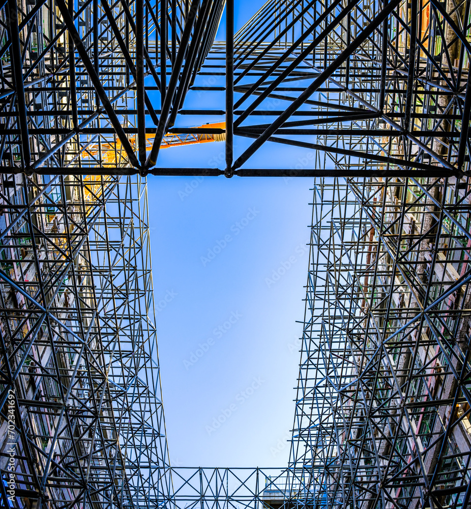 Poster typical scaffolding at a construction site