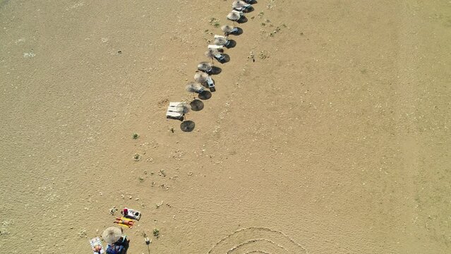 Drone shooting on the beach and down to the sea. Beaches and people swimming in the sea in summer. &Ccedil;ıralı, Antalya coast in the summer of 2023. 4K coast and beach shots.